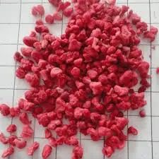 A pile of red food on top of a white counter.
