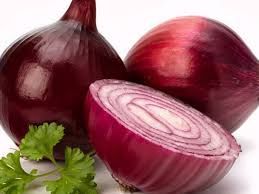 A close up of red onions on a table