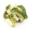 A pile of broccoli and other vegetables on top of a white surface.