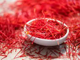 A bowl of saffron is sitting on the table.